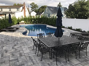 nicolock granite city alpine smooth brick paver patio around pool bullnose coping gray brick pool patio